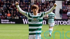 Celtic wrap up league title with victory at 10-man Hearts