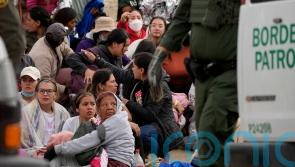 Surge of migrants at US-Mexico border before restrictions are lifted