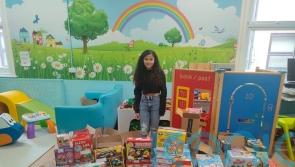 Cancer survivor takes toys to children on hospital ward that cared for her