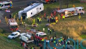 Truck driver charged as seven children seriously injured in school bus crash