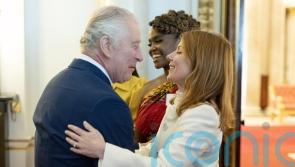 Spice Girl Geri gives King a hug, a kiss and a pep talk