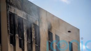 Man charged after hostel ‘arson attack’ that killed at least six people