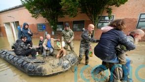 Death toll rises to 13 as rescue workers bid to reach towns cut off by floods