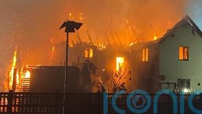 Dogs alert owners to huge house fire by barking in early hours