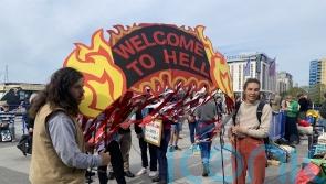 Climate change protesters try to storm the stage at tense Shell AGM