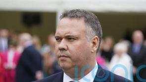 Detective who survived murder attempt attends garden party with King and Queen