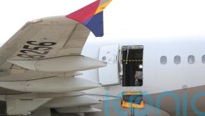 12 injured after South Korea plane passenger opens door during flight