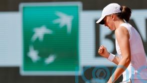French Open day five: Iga Swiatek eases through as Daniel Altmaier shocks Sinner