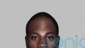 Police release e-fit image of man found dead in plane undercarriage