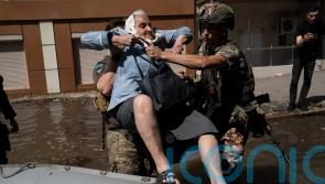 Ukraine rushes drinking water to flooded areas after major dam breach