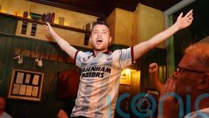 Celebrating West Ham fans dance on tables after European final win