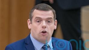 Minister urges Ross to apologise for drag queen comments and join library event