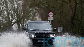 How should I drive in a thunderstorm?