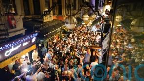 Manchester City fans take over streets of Istanbul with flares and chants