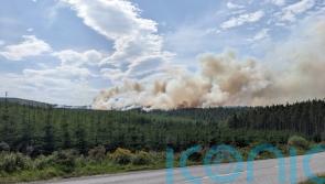Firefighters continue to tackle raging wildfire in Highlands
