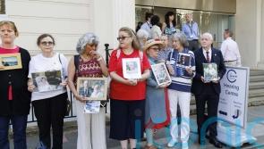 Bereaved families hold pictures of loved ones in vigil outside Covid inquiry