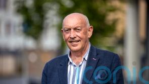 Man who helped bring about Queen and McGuinness handshake becomes a CBE