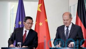 Germany presses China over Ukraine as leaders pledge to work together on climate