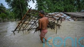 Flooding displaces tens of thousands as monsoon rains batter Indian villages