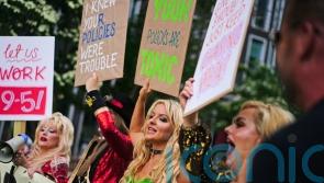 Celebrity impersonators banned from Facebook protest outside Meta offices