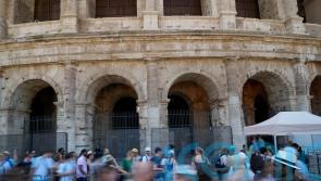 Man filmed carving name on Colosseum is tourist living in Britain, police say
