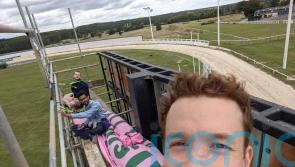 Animal Rising activists scale race track scaffold ahead of Greyhound Derby Final