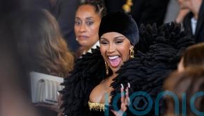Cardi B and Tracee Ellis Ross sit front row at Schiaparelli show in Paris