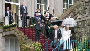 Rain hailed as ‘next year’s whisky’ as 8,000 attend royal garden party