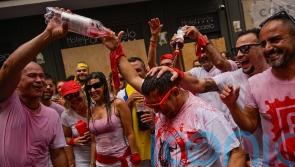 Thousands party in Pamplona as firework blast begins bull-running festival