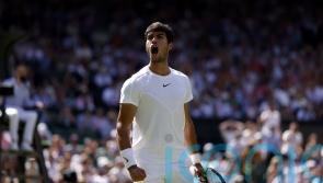 Top seed Carlos Alcaraz battles into third round at Wimbledon