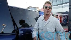 Brad Pitt cheers fans at Silverstone paddock ahead of British Grand Prix