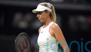 Wimbledon fans endure dark and damp conditions to cheer on Katie Boulter