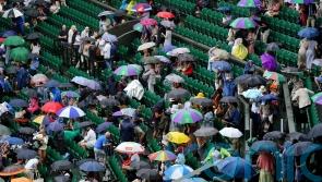Tennis fans in macs and under umbrellas in queue for Wimbledon’s middle Sunday