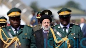 Iranian president welcomed in Zimbabwe with anti-West songs