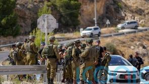 Two girls among injured after Palestinian gunman opens fire on car in West Bank