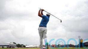 Early starters battle overcast conditions as Tommy Fleetwood shares Open lead