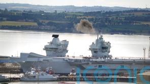 HMS Prince of Wales leaves dry dock after nine months of repairs