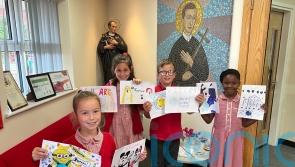 Primary school children take action after murals at refugee centre painted over