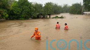 Typhoon rips off roofs, floods villages and displaces thousands in Philippines