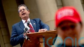 Michigan prosecutors charge Trump allies with vote machine tampering