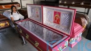 Funeral home offers pink coffins with Barbie lining