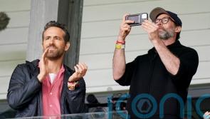 Hugh Jackman watches Wrexham game with Ryan Reynolds and Rob McElhenney