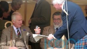 King enjoys wee dram at Highland Games