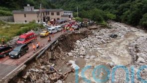 China residents evacuated from homes amid search for more mudslide victims