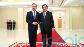 China’s foreign minister visits Cambodia days after premier hands role to son