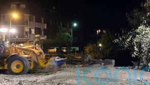 Crews clear streets after mudslide swamps town in Italian Alps