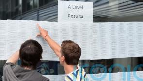 Students receive A-level results as ministers aim to return to pre-Covid grading