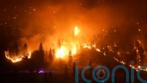 Canadian firefighters wage battle to save communities after mass evacuations