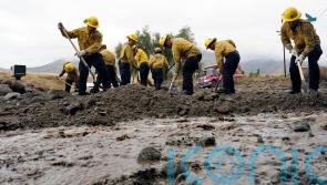 Rescue crews dig towns out of the mud as Tropical Storm Hilary weakens