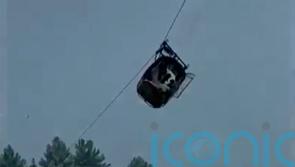 Children among eight trapped in cable car hundreds of feet above Pakistan canyon